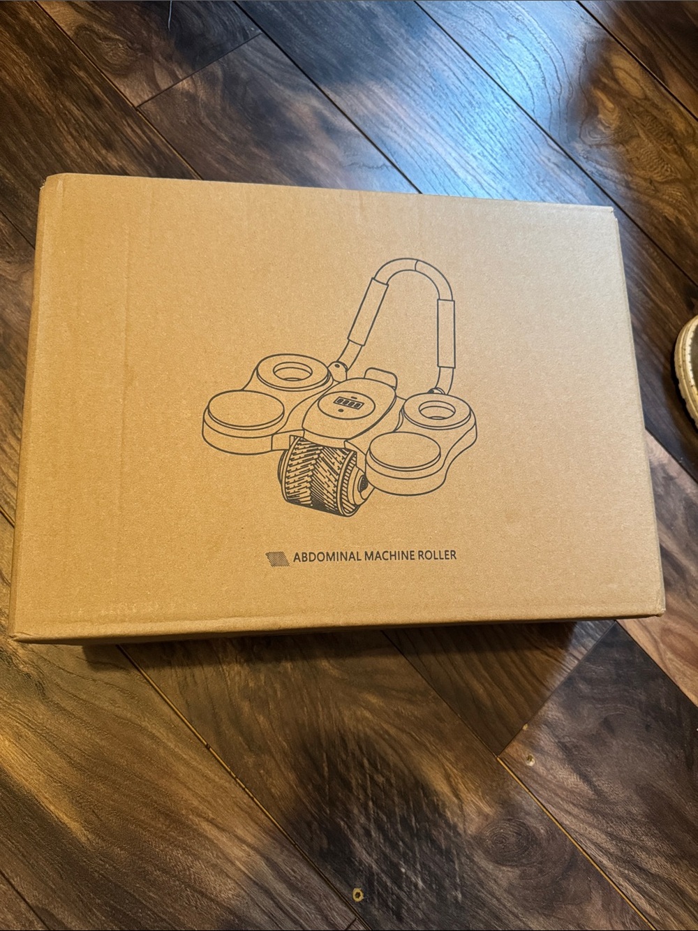 Abdominal Machine Roller - Brown Cardboard Packaging
